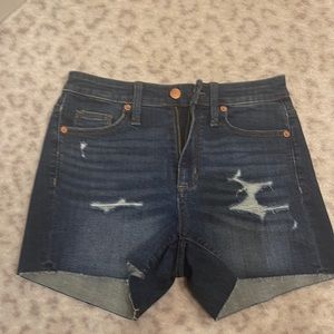 Dark denim distressed cut off shorts.   Size 2/26.  New without tags